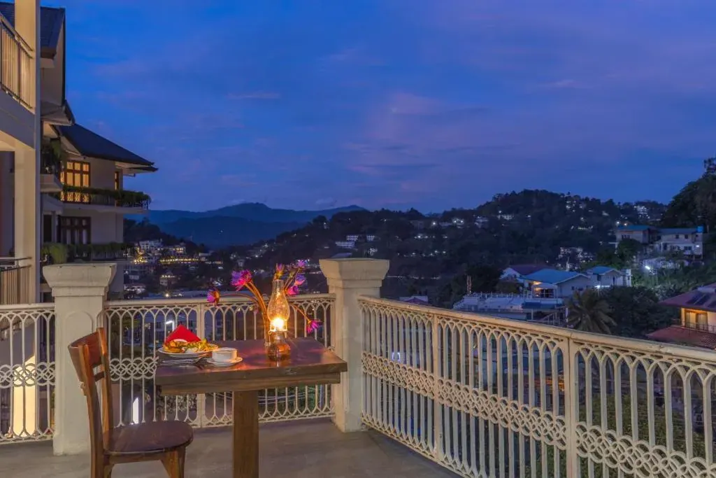 The exterior and pool deck of Hotel Cassendra in Kandy