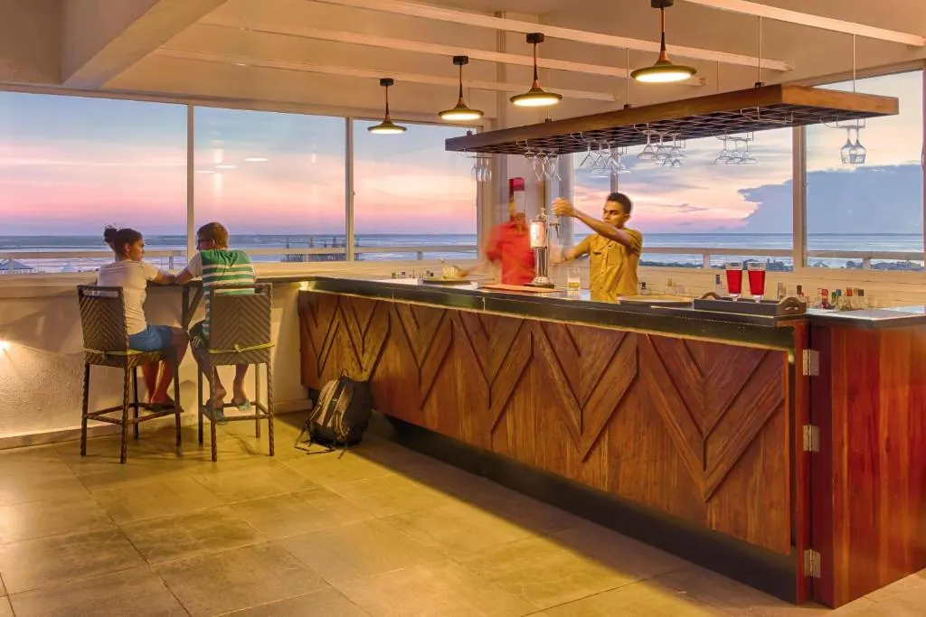 The rooftop bar at Jetwing Jaffna, its windows open to the lagoon at sunset