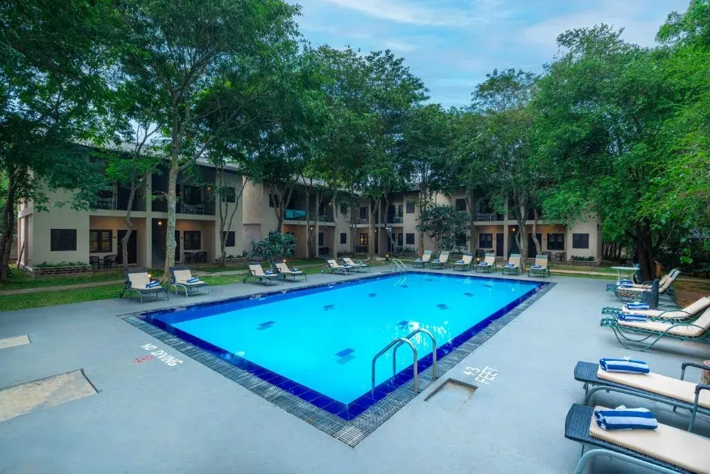 The pool and garden terrace at Kassapa Lions Rock hotel near Sigiriya