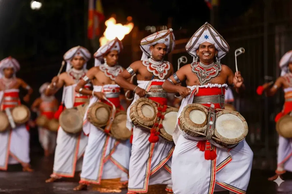 Kandyan dancers and drummers in traditional costume performing at the Esala Perahera